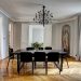 Black dining room table with chandelier